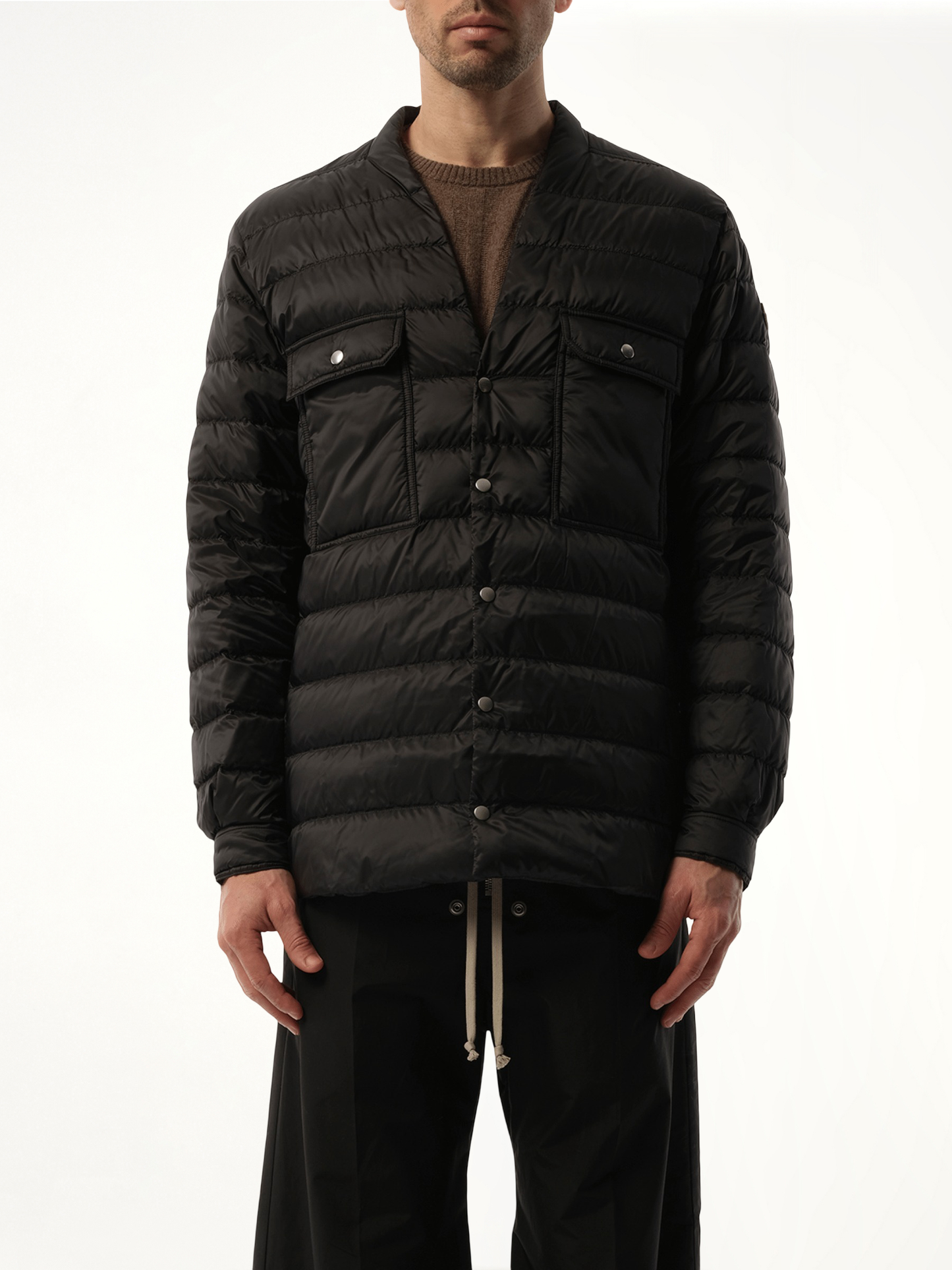 Image of a model wearing Tops. Product name - Rick Owens x Moncler Padded Outershirt in Black colour by brand - RICK OWENS