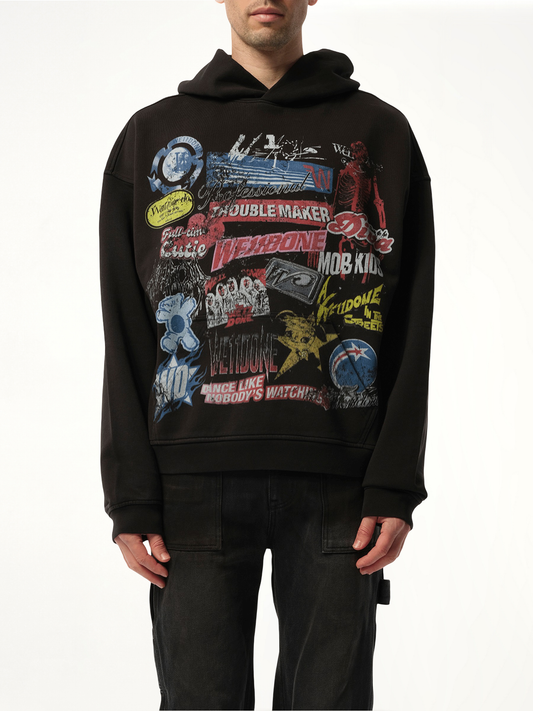 Image of a model wearing Outerwear. Productname: WE11DONE Vintage Collage Hoodie in Black colour by brand - WE11DONE