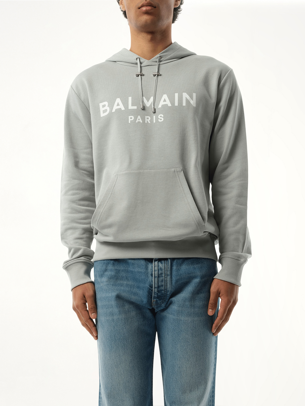 Image of a model wearing Outerwear. Product name - Balmain Print Hoodie in Grey colour by brand - BALMAIN