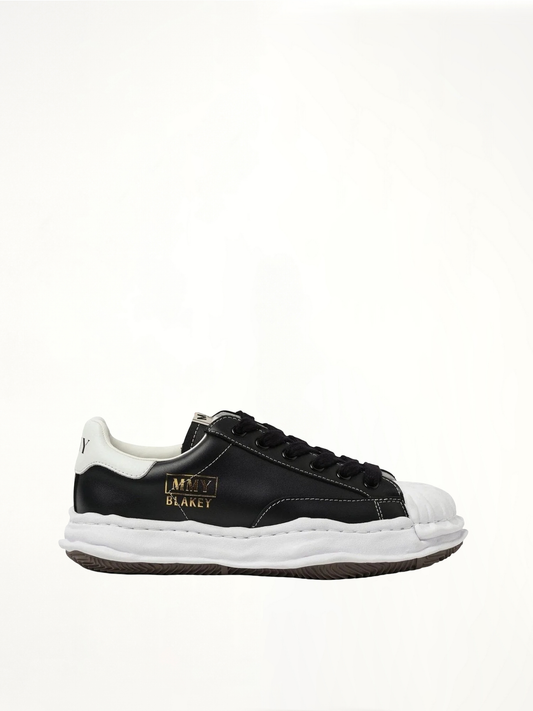 Image of Sneakers. Product name - BLAKEY OG Leather Low Top Sneaker in Black colour by brand - MAISON MIHARA YASUHIRO