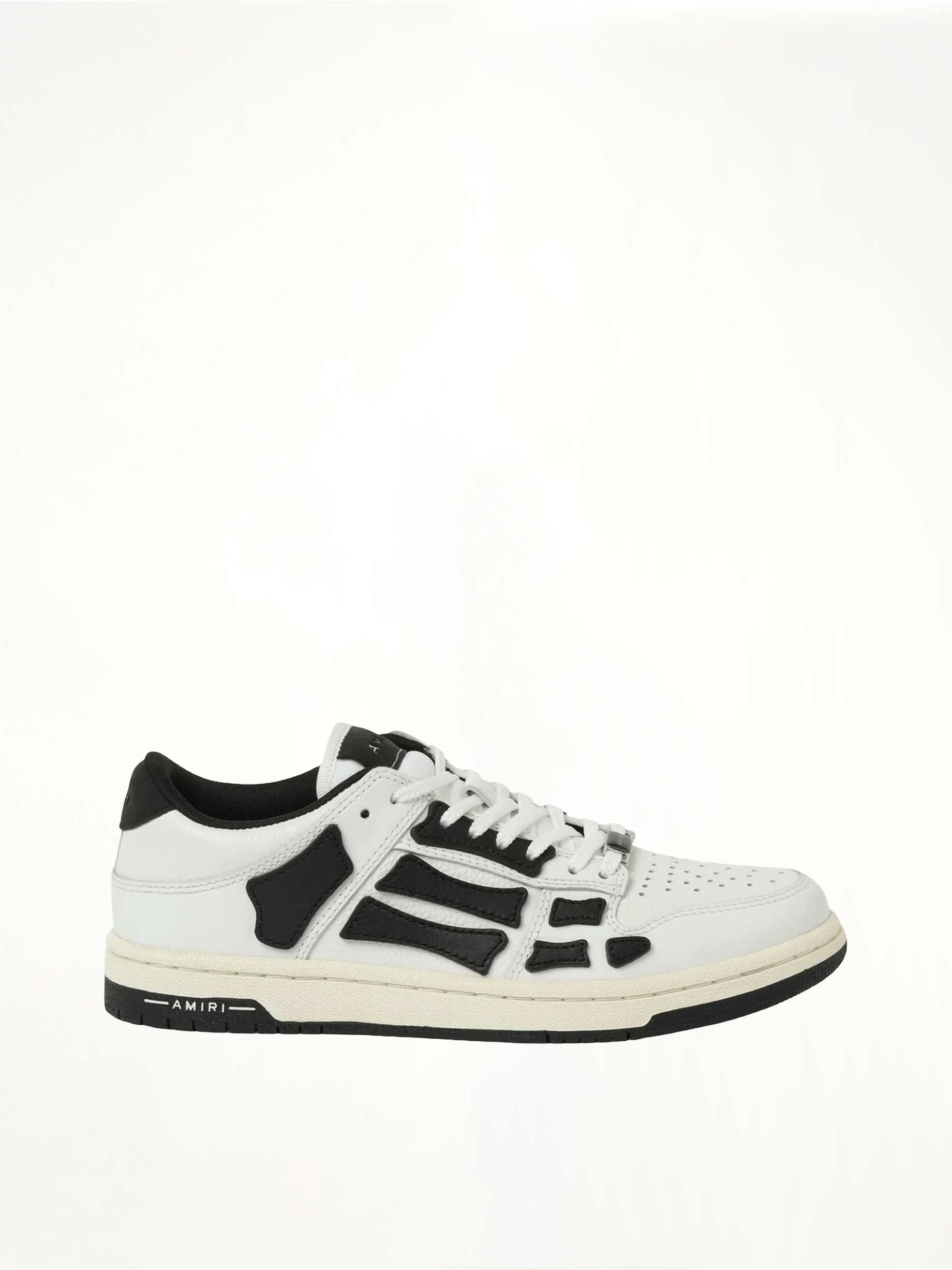 Image of Sneakers. Product name - Skeleton Low Top Sneaker in White colour by brand - AMIRI