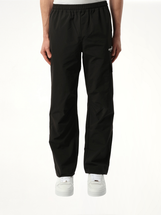 Image of a model wearing Pants. Productname: REPRESENT Represent Owners Club Pant in Black colour by brand - REPRESENT