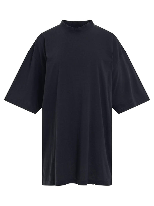 Image of a model wearing Tops. Productname: BALENCIAGA Logo Printed Crewneck T-shirt in BLACK colour by brand - BALENCIAGA