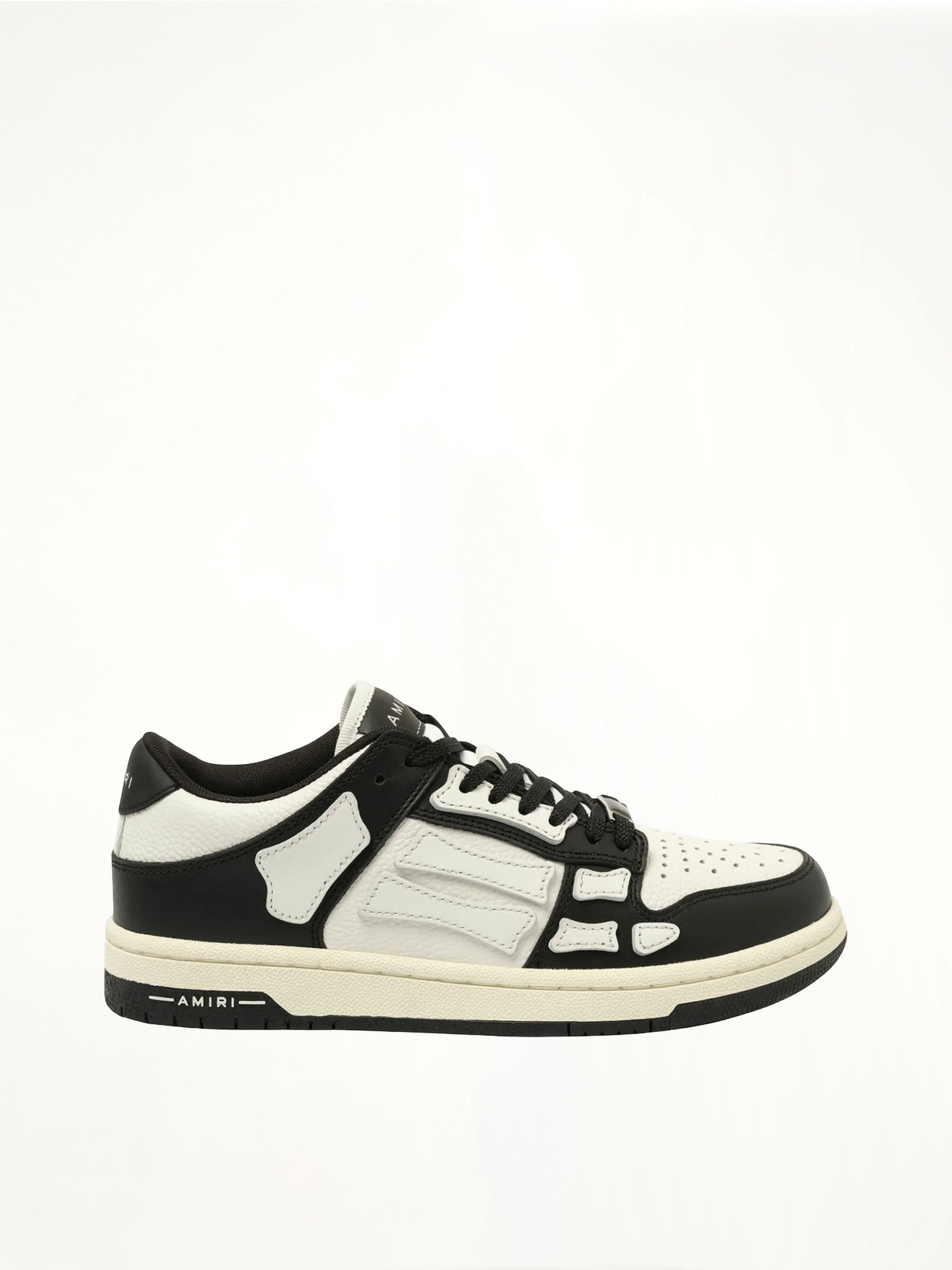 Image of Sneakers. Product name - Skeleton Low top Sneaker in Black colour by brand - AMIRI