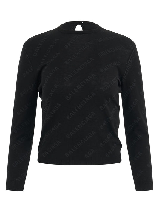 Image of a model wearing Outerwear. Productname: BALENCIAGA Allover Logo Knit Sweater in Black colour by brand - BALENCIAGA