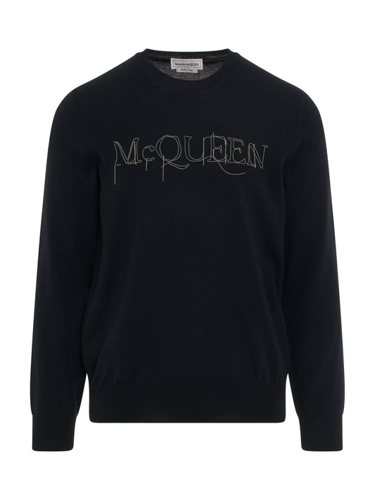 Image of a model wearing Outerwear. Productname: ALEXANDER MCQUEEN Chain Embroidered Knit Sweater in BLACK colour by brand - ALEXANDER MCQUEEN