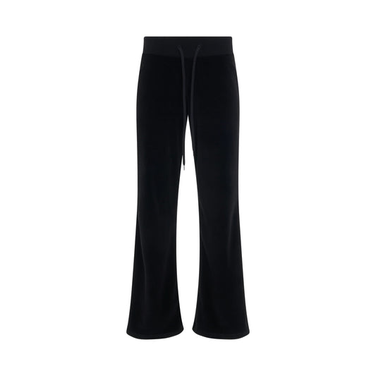 Image of a model wearing Pants. Product name - Low-Waist Velvet Joggers Pants in Black colour by brand - BALENCIAGA