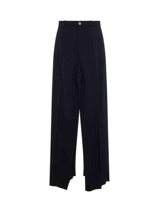 Image of a model wearing Pants. Productname: BALENCIAGA Deconstructed Double Front Pants in Black colour by brand - BALENCIAGA