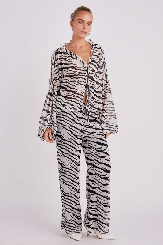 Image of a model wearing Pants. Productname: SNDYS Instinct Pant in Zebra colour by brand - SNDYS