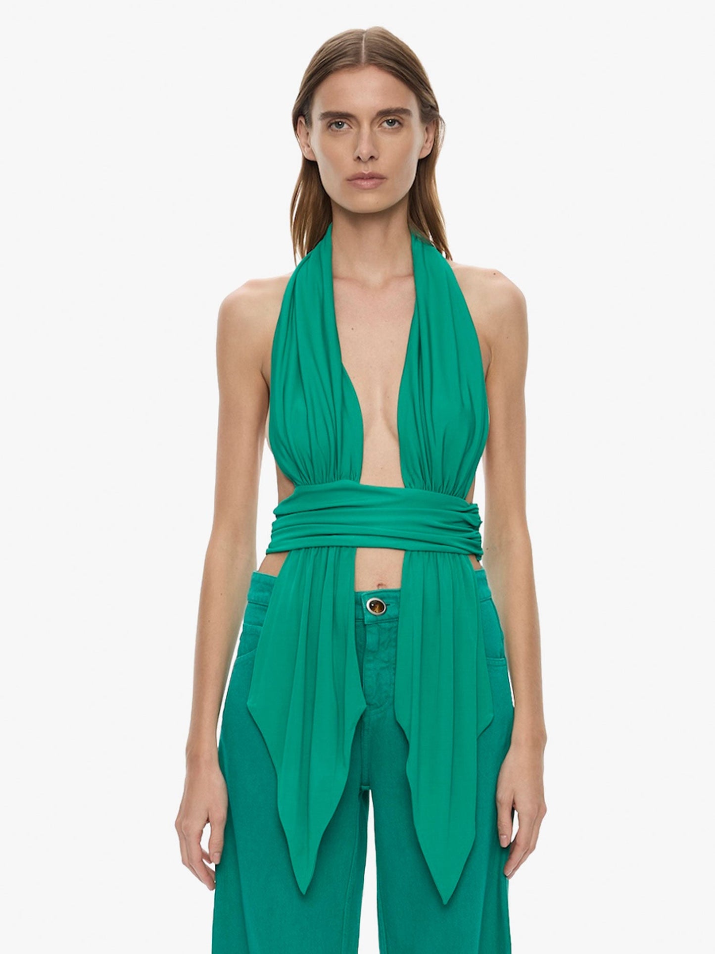 Image of a model wearing Tops. Product name - Scarf Draped Halter Top in Malachite colour by brand - CHRISTOPHER ESBER