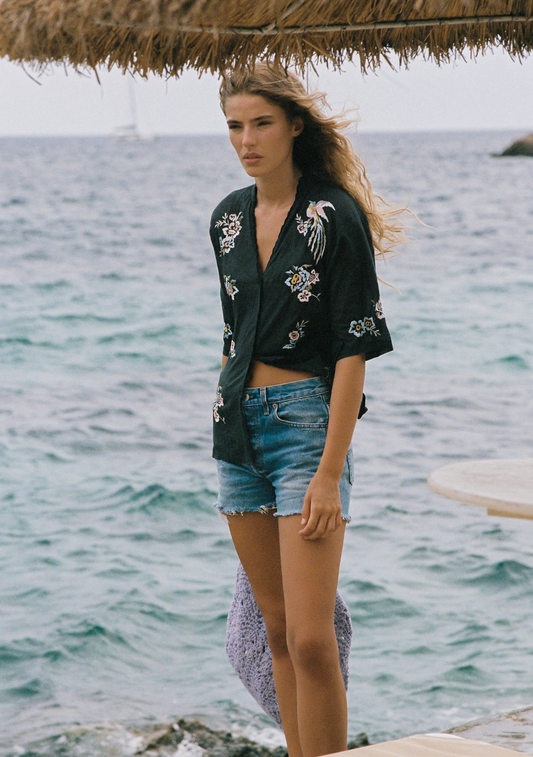 Image of a model wearing Tops. Productname: Auguste The Label Viola Blouse in Black colour by brand - Auguste The Label