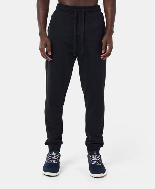 Image of a model wearing Pants. Product name - HH FLEECE PANT, Black in Black colour by brand - Helly Hansen
