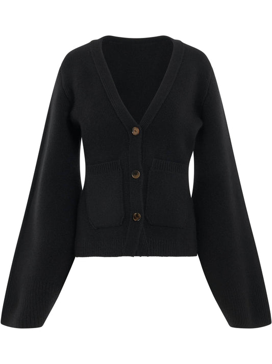 Image of a model wearing Outerwear. Productname: KHAITE Scarlet Cardigan in BLACK colour by brand - KHAITE