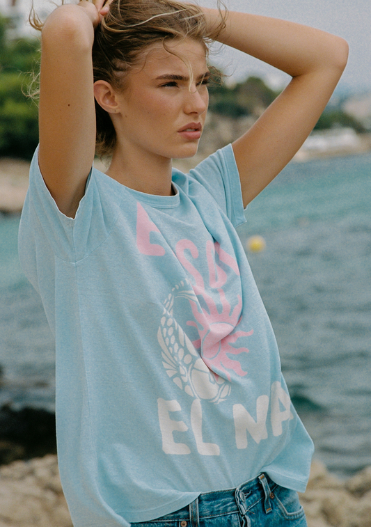 Image of a model wearing Tops. Productname: Auguste The Label Sol Classic Tee in Blue colour by brand - Auguste The Label