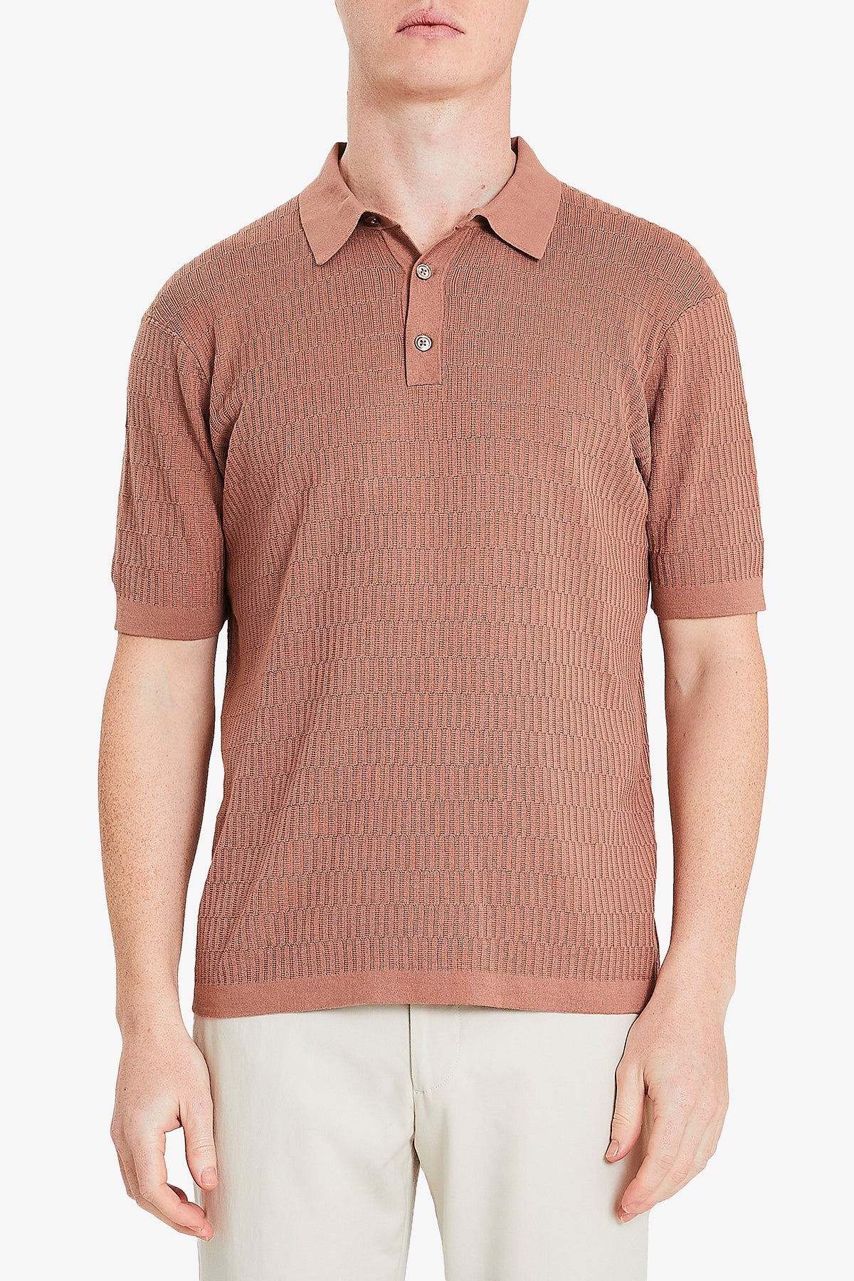 Image of a model wearing Tops. Product name - Long Island Knitted Polo Terracotta in Terracotta colour by brand - Anthony Squires