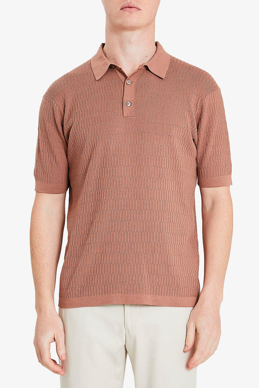 Image of a model wearing Tops. Product name - Long Island Knitted Polo Terracotta in Terracotta colour by brand - Anthony Squires