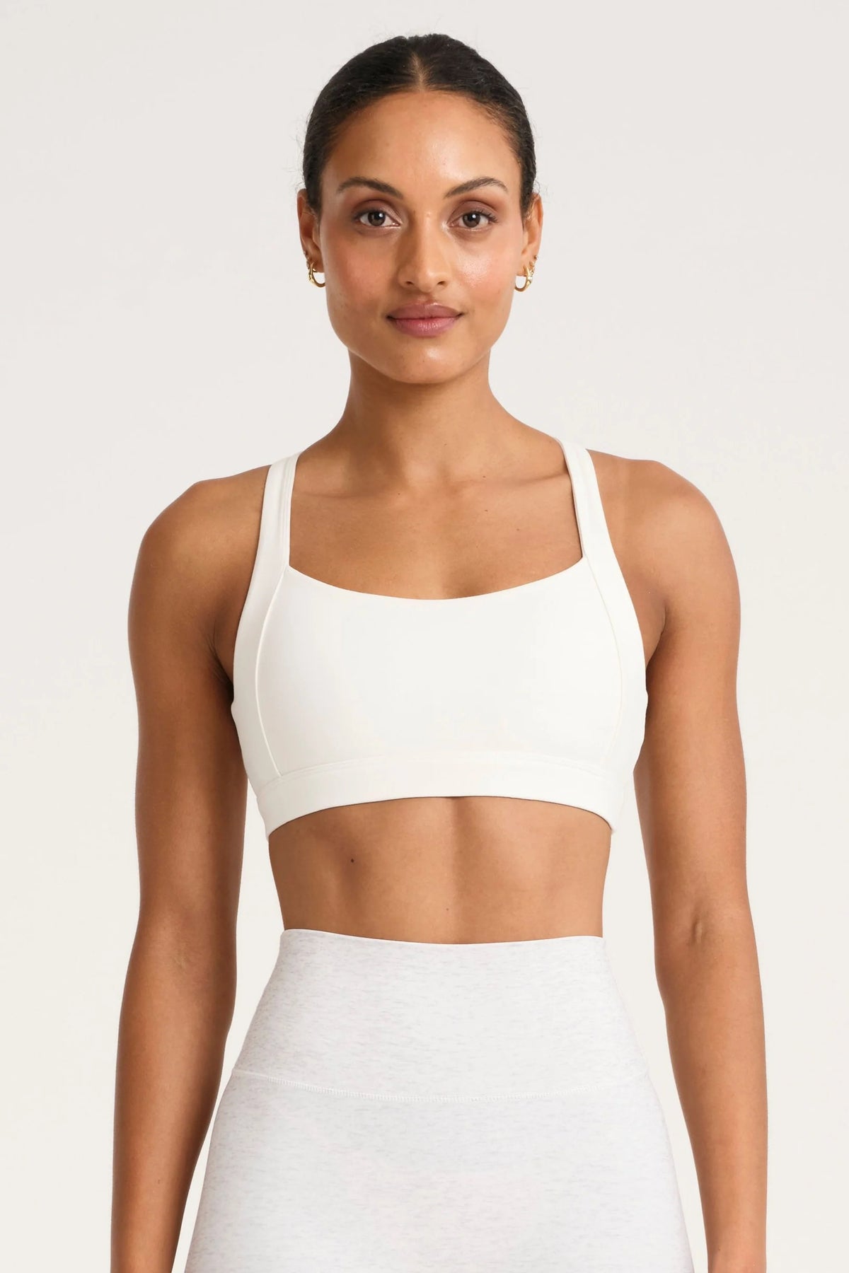 Image of Activewear. Product name - ALLFENIX CloudCore Cross Over Core Sports Bra in Chalk colour by brand - All Fenix