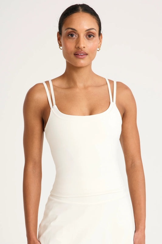 Image of a model wearing Tops. Product name - ALLFENIX CloudCore Double Layer Tank in Tan colour by brand - All Fenix