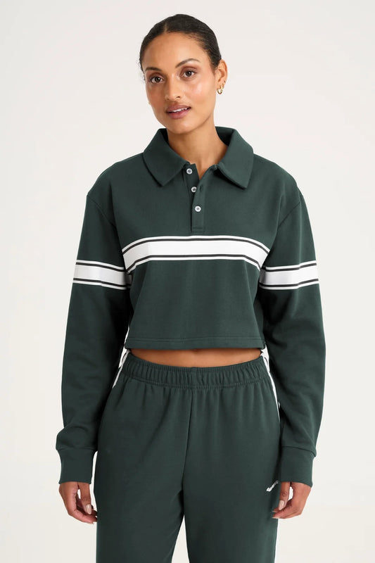 Image of a model wearing Outerwear. Product name - Collegiate Cropped Polo Forest in Green colour by brand - All Fenix