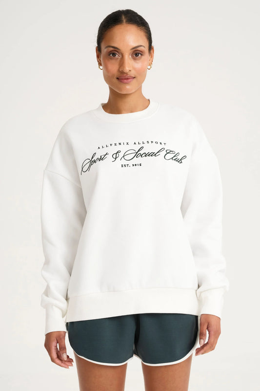 Image of a model wearing Outerwear. Product name - Collegiate Graphic Crew Neck Jumper in White colour by brand - All Fenix