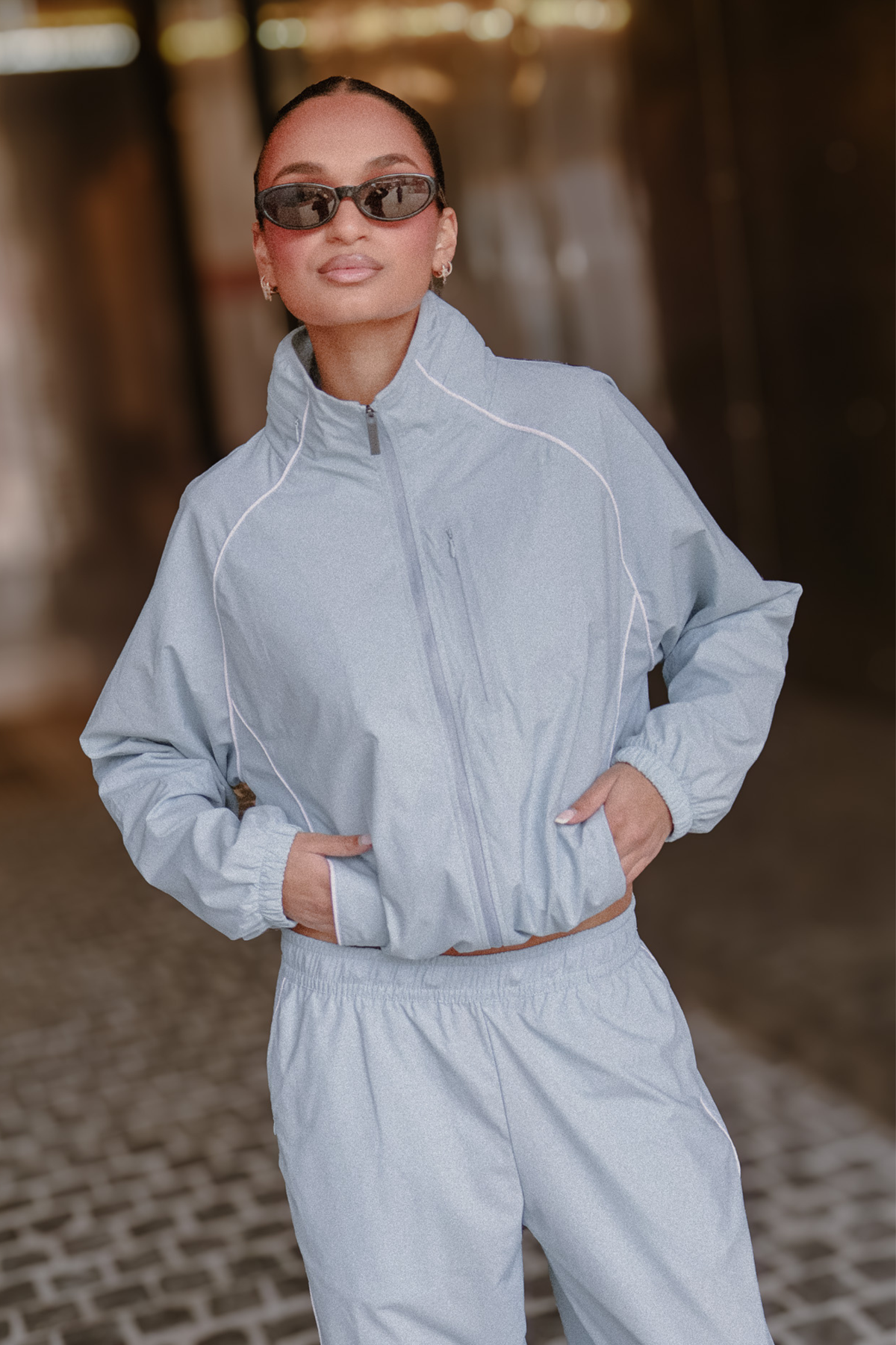Image of a model wearing Outerwear. Product name - Spray Contrast Piping Set in Blue colour by brand - All Fenix
