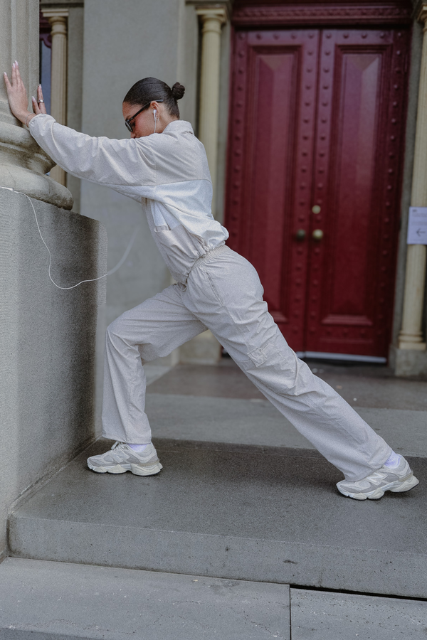 Image of a model wearing Outerwear. Product name - Spray Paneled Set in Stone colour by brand - All Fenix