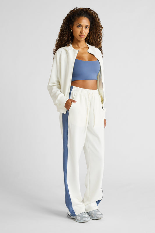 Image of a model wearing Pants. Product name - Soft Essentials Contrast Wide Leg Pant Chalk/Blue Indigo in Blue colour by brand - All Fenix