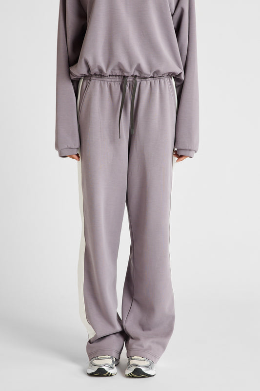 Image of a model wearing Pants. Product name - Soft Essentials Contrast Wide Leg Pant Graphite/Chalk in Chalk colour by brand - All Fenix