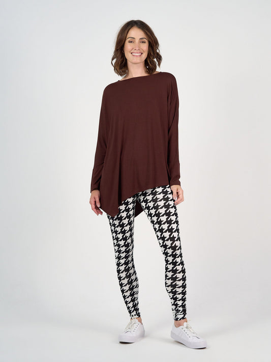 Image of a model wearing Tops. Product name - Susie Oversized Asymmetrical Bamboo Top Burgundy in Burgundy colour by brand - Lou Lou