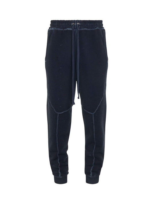 Image of a model wearing Pants. Productname: A-COLD-WALL Studio Jersey Sweatpants in NAVY colour by brand - A-COLD-WALL