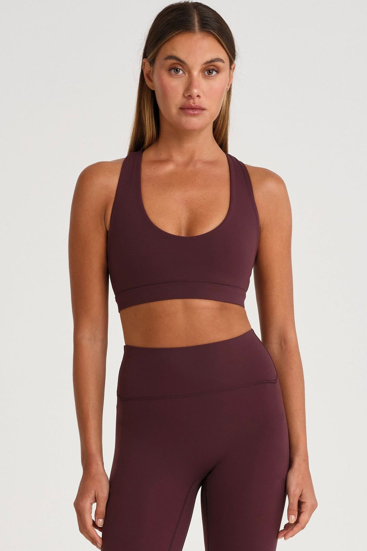 Image of Activewear. Product name - ALLFENIX CloudCore Scoop Neck Racer Back Sports Bra in Raisin colour by brand - All Fenix