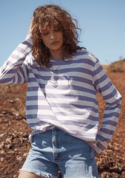 Image of a model wearing Tops. Productname: Auguste The Label Alden North Long Sleeve Tee in Purple colour by brand - Auguste The Label