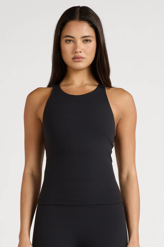 Image of a model wearing Tops. Product name - EcoSculpt Racer Tank in Black colour by brand - All Fenix