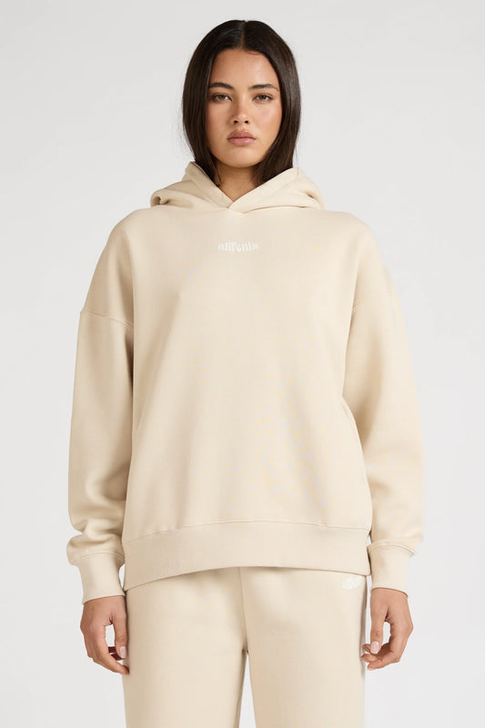 Image of a model wearing Outerwear. Product name - Pilates Club Hoodie in Clay colour by brand - All Fenix