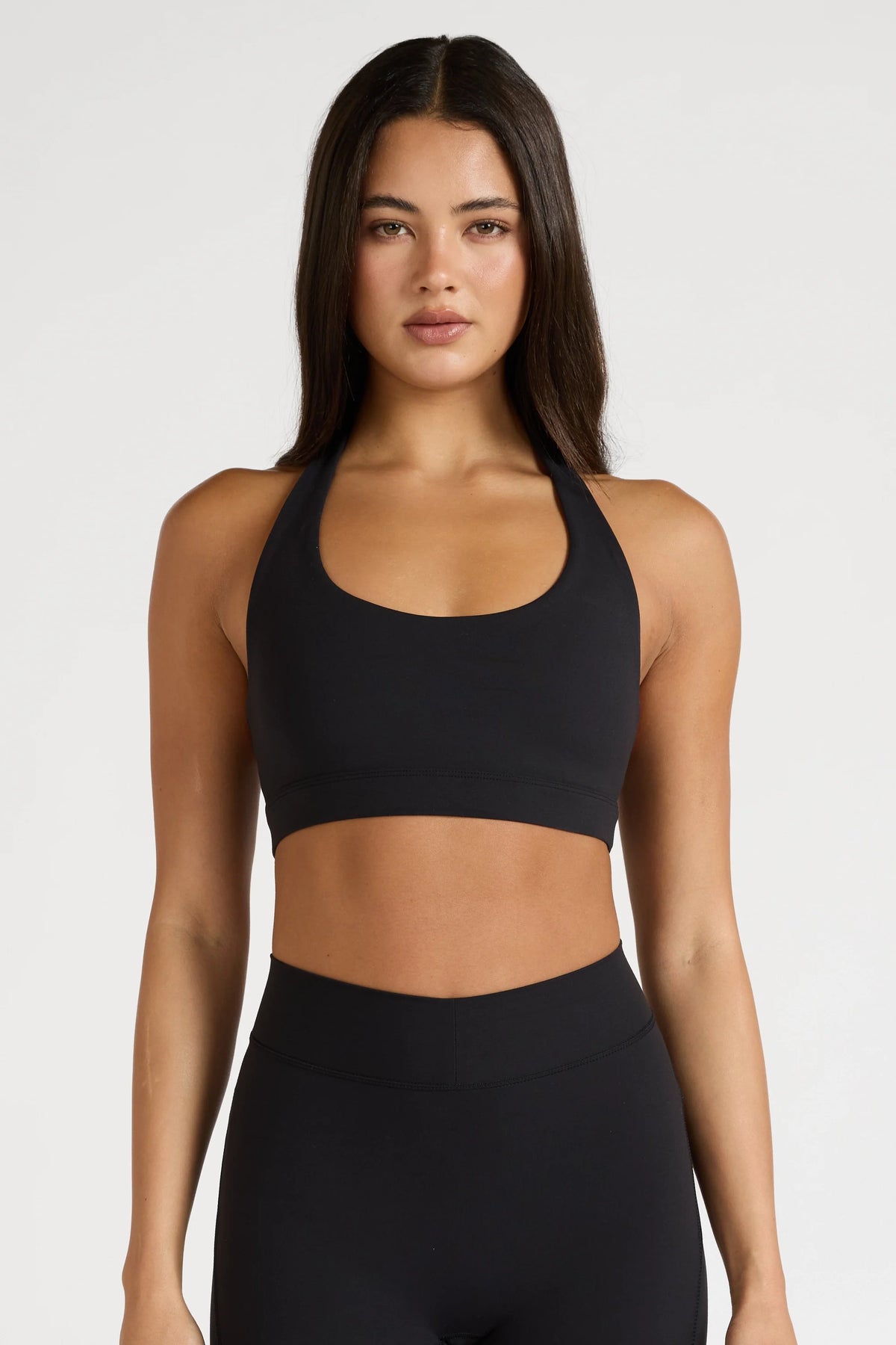 Image of Activewear. Product name - EcoSculpt Halter Sports Bra in Black colour by brand - All Fenix