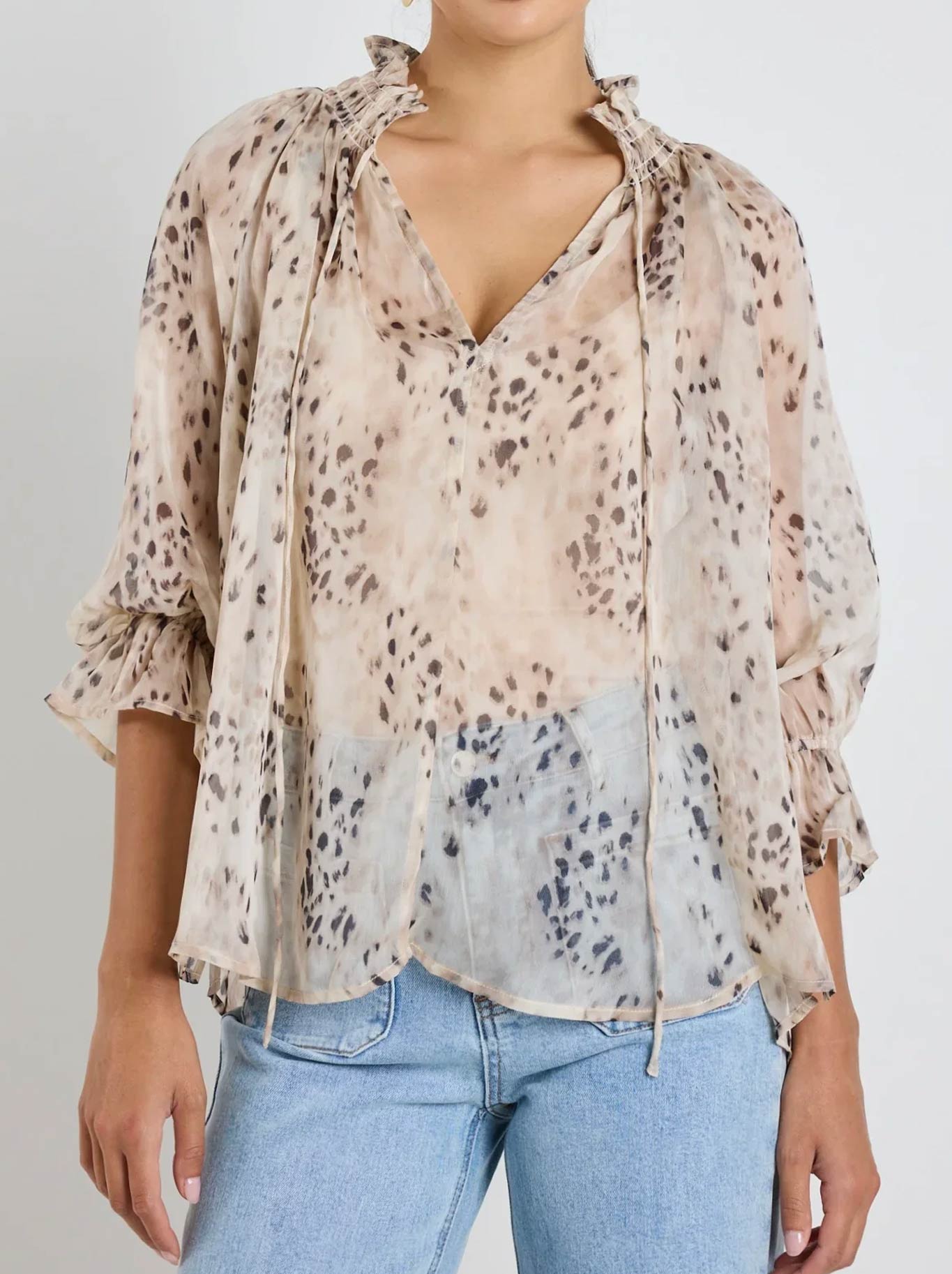 Image of a model wearing Tops. Productname: AMONG THE BRAVE ODYSSEY LEOPARD SHIRRED TOP in Leopard colour by brand - Among The Brave