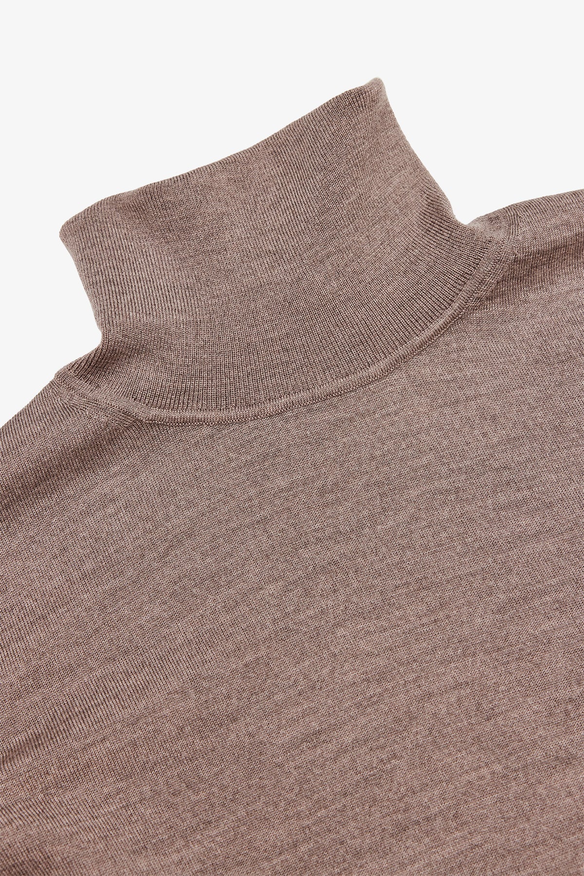 Image of a model wearing Outerwear. Product name - Kurt Beige Roll-neck Knitwear in Beige colour by brand - Anthony Squires
