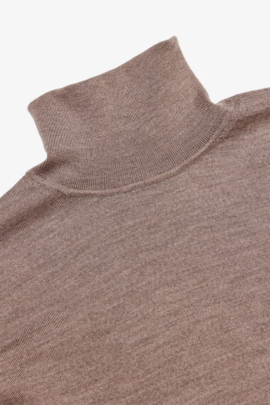 Image of a model wearing Outerwear. Product name - Kurt Beige Roll-neck Knitwear in Beige colour by brand - Anthony Squires