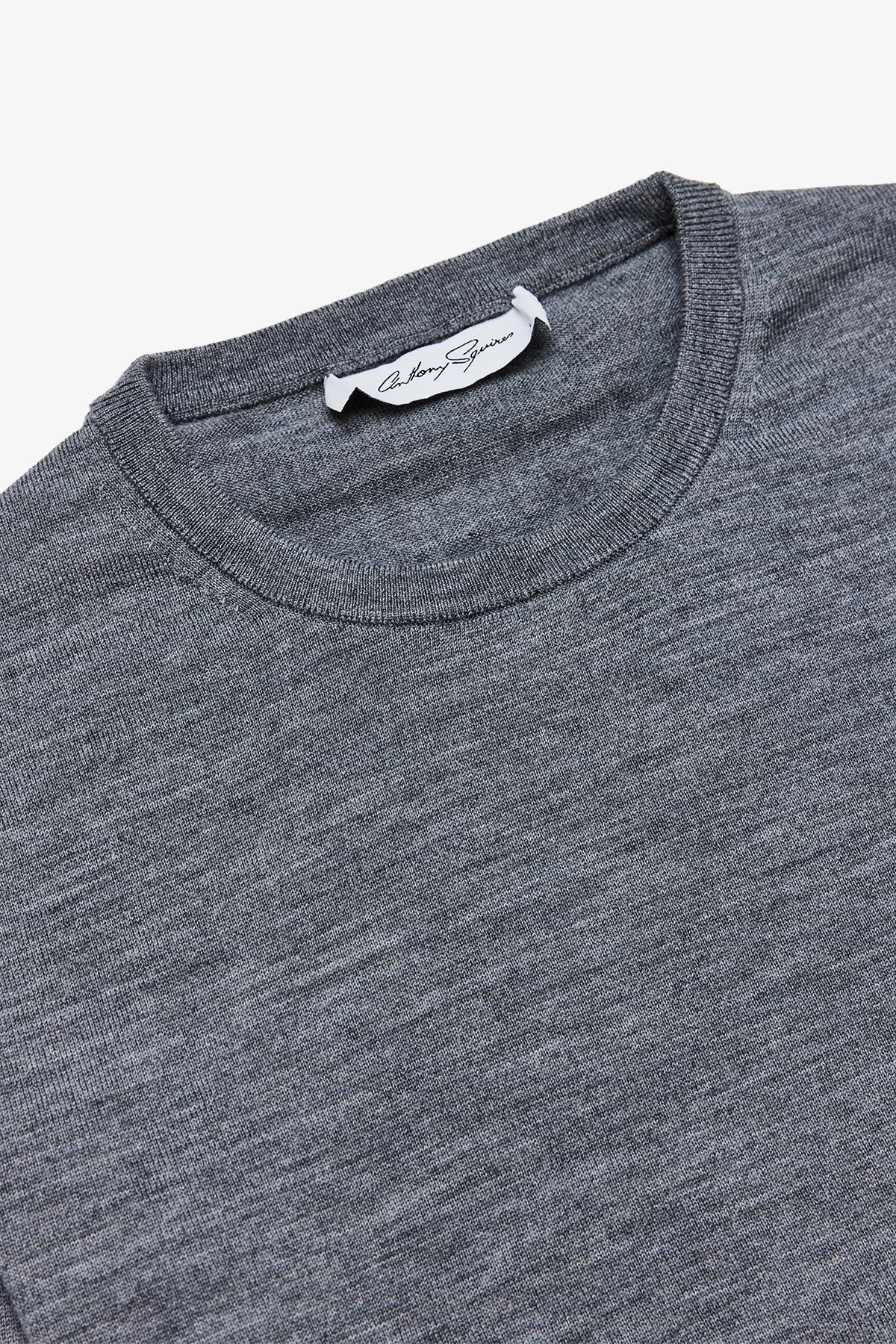 Image of a model wearing Tops. Product name - Oscar Mid Grey Crewneck Knit in Grey colour by brand - Anthony Squires