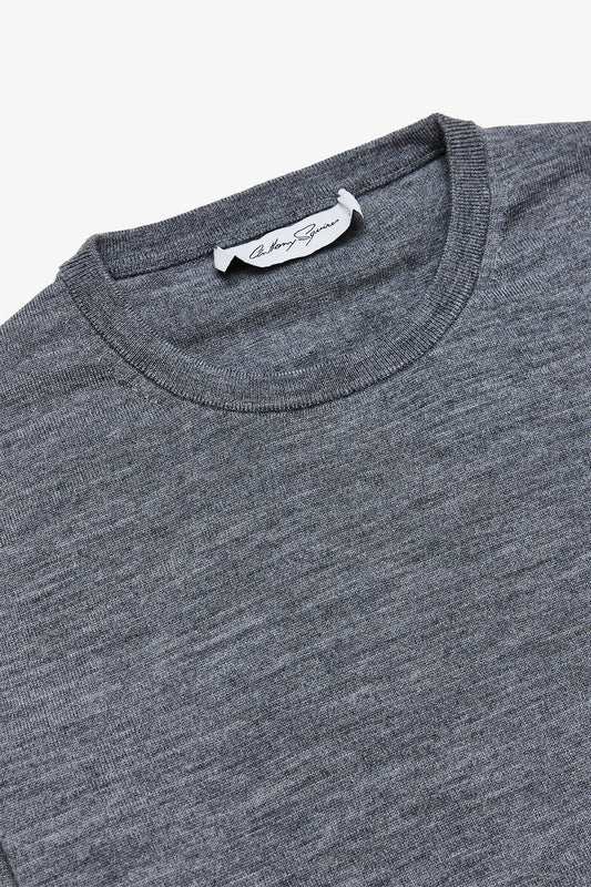 Image of a model wearing Tops. Product name - Oscar Mid Grey Crewneck Knit in Grey colour by brand - Anthony Squires