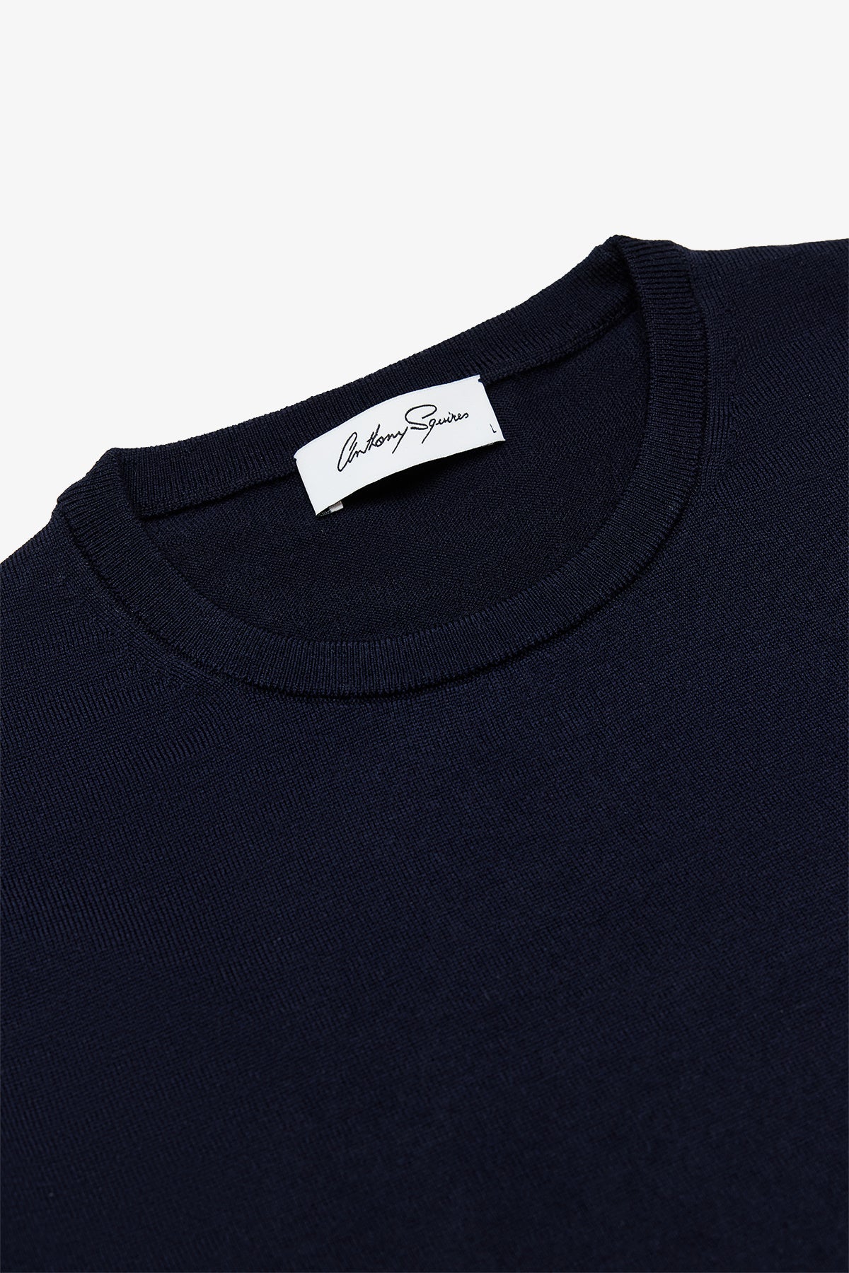Image of a model wearing Tops. Product name - Oscar Navy Crewneck Knit in Navy colour by brand - Anthony Squires