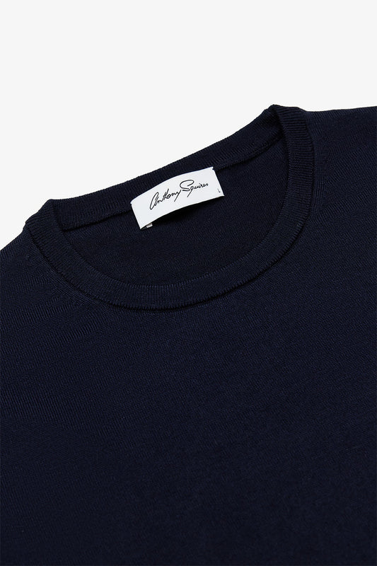 Image of a model wearing Tops. Product name - Oscar Navy Crewneck Knit in Navy colour by brand - Anthony Squires