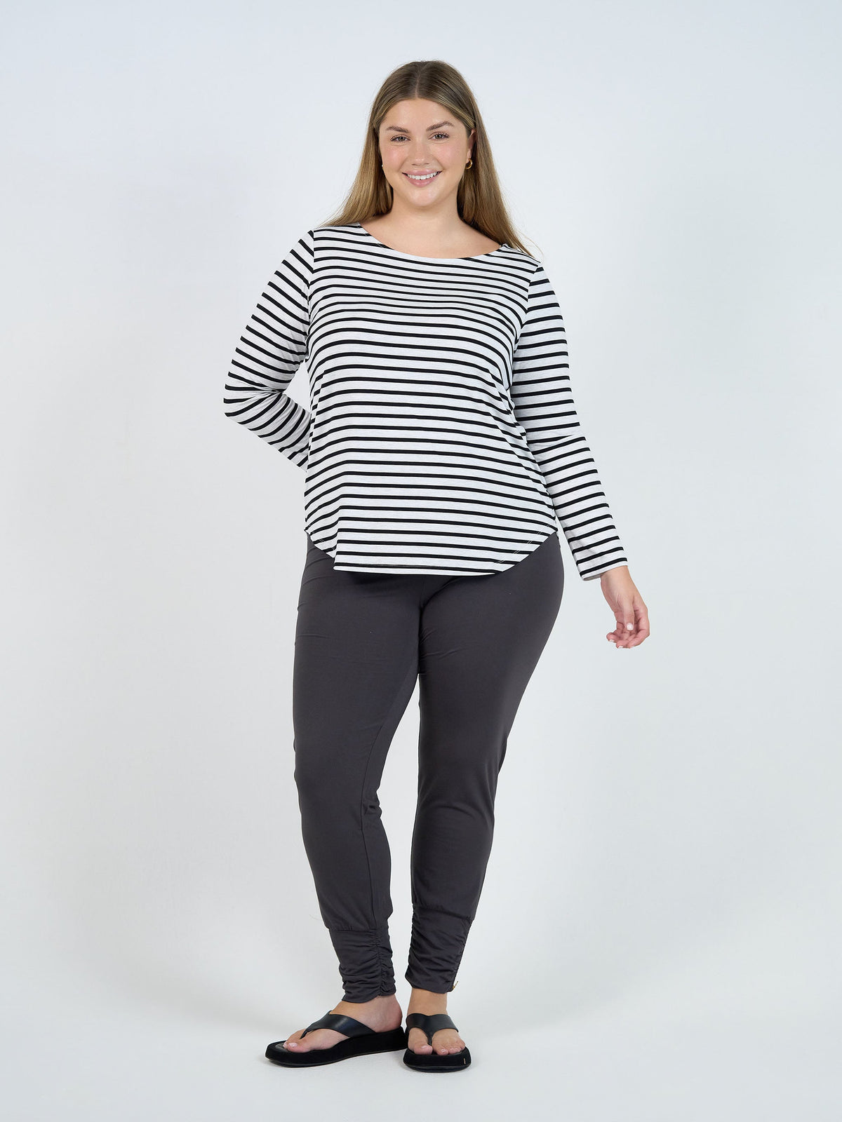 Image of a model wearing Tops. Product name - Adele Long Sleeve Bamboo Top Grey Marle & Black Stripe in Grey Marle & Black Stripe colour by brand - Lou Lou