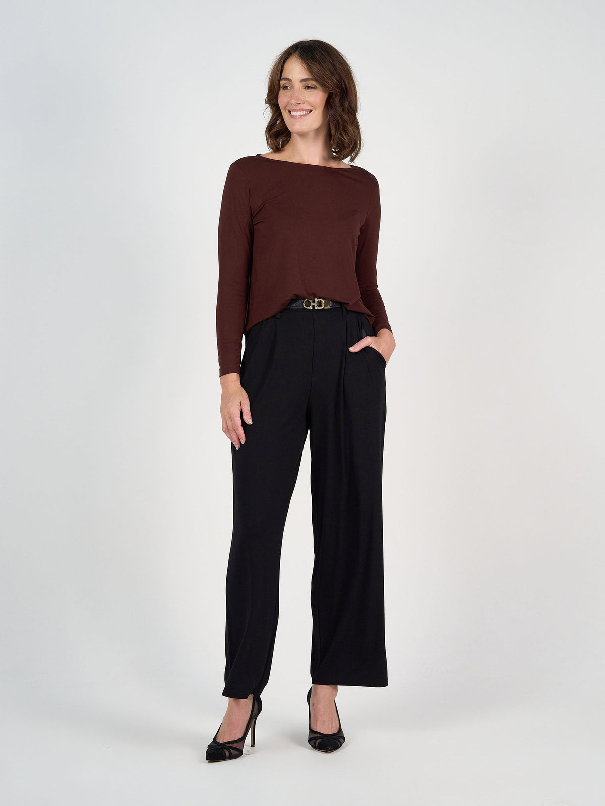 Image of a model wearing Tops. Product name - Adele Long Sleeve Bamboo Top Burgundy in Burgundy colour by brand - Lou Lou