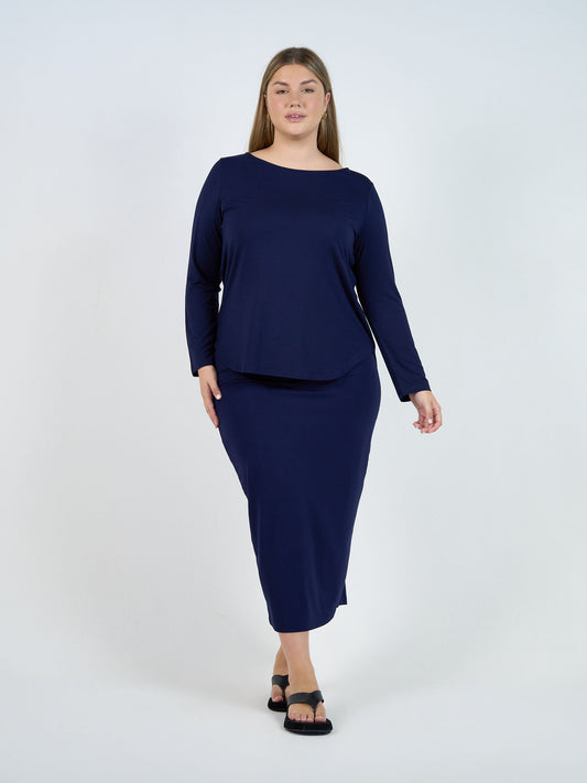 Image of a model wearing Tops. Product name - Adele Long Sleeve Bamboo Top Navy in Navy colour by brand - Lou Lou