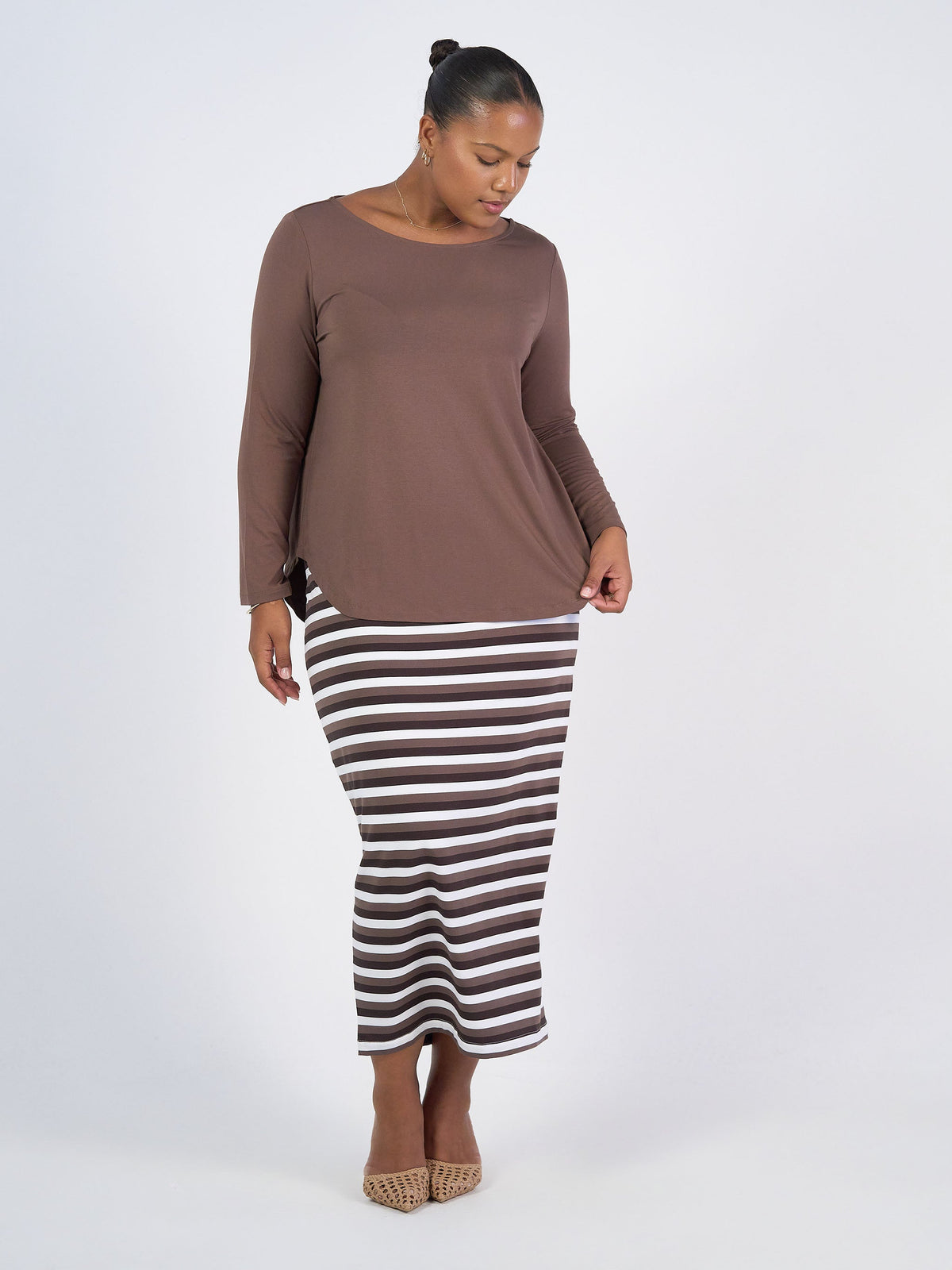 Image of a model wearing Tops. Product name - Adele Long Sleeve Bamboo Top Chocolate in Chocolate colour by brand - Lou Lou
