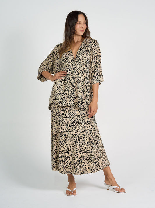 Image of a model wearing Tops. Product name - Alanis 3/4 Sleeve Collared Shirt Brown Leopard in Brown Leopard colour by brand - Lou Lou