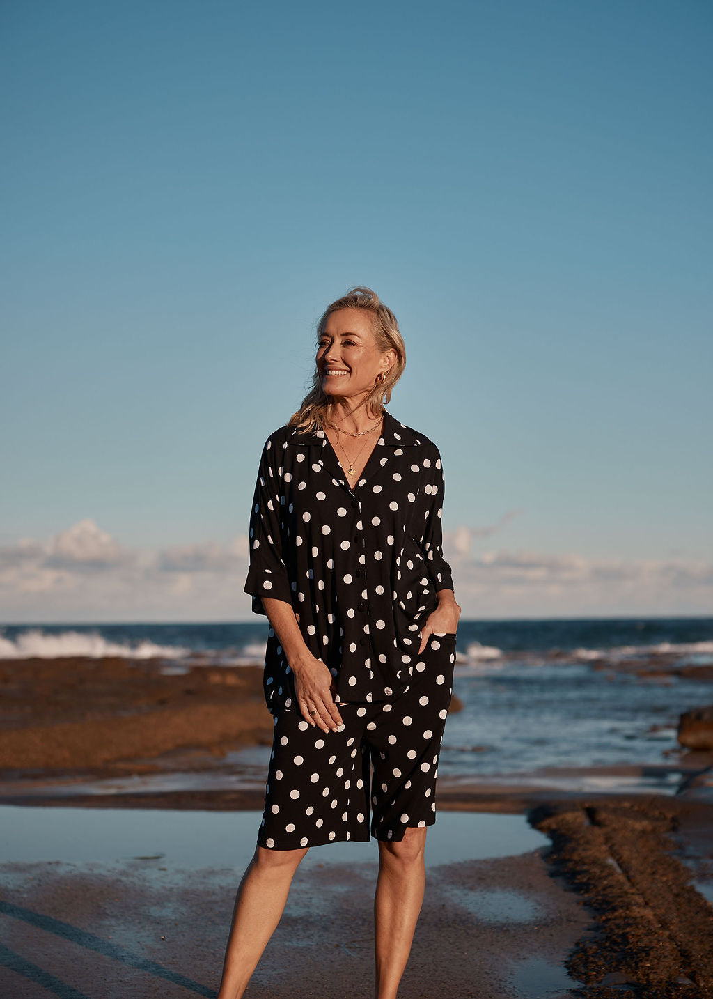 Image of a model wearing Shorts. Product name - Simone Wide Leg Bamboo Shorts Polka Dot in Polka Dot colour by brand - Lou Lou