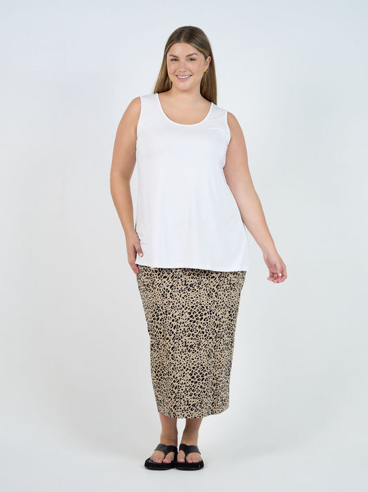 Image of a model wearing Tops. Product name - Alicia Reversible Bamboo Singlet Top White in White colour by brand - Lou Lou