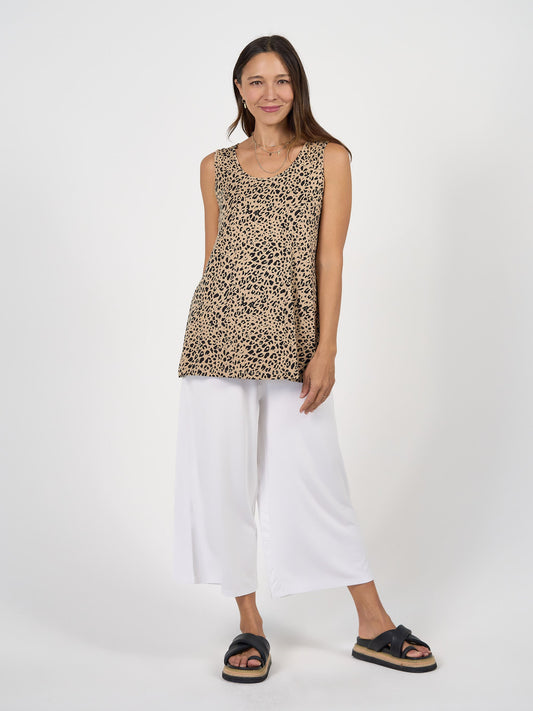 Image of a model wearing Tops. Product name - Alicia Reversible Bamboo Singlet Top Brown Leopard in Brown Leopard colour by brand - Lou Lou